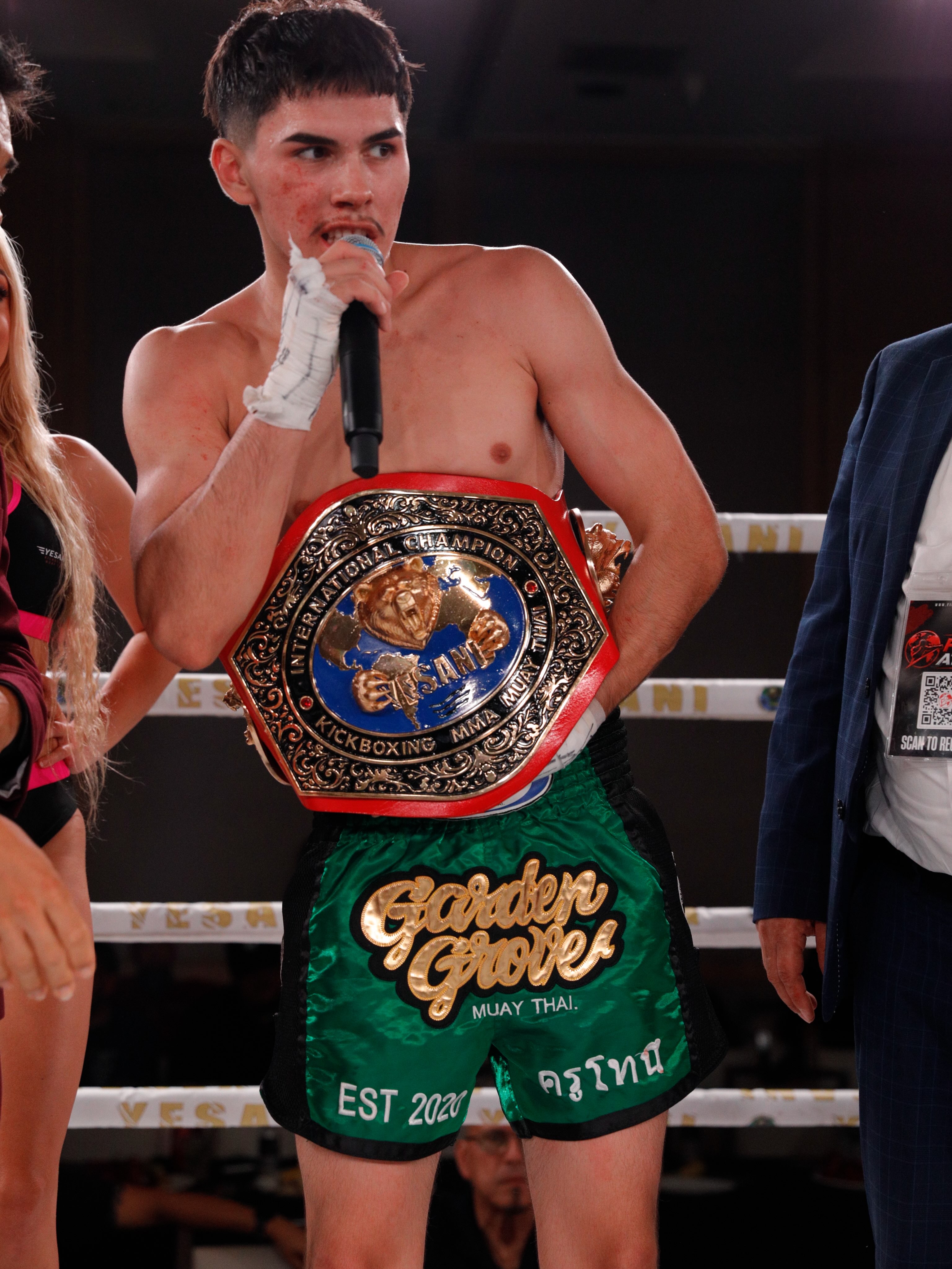 Garden Grove Muay Thai fighter Alexander celebrating a win